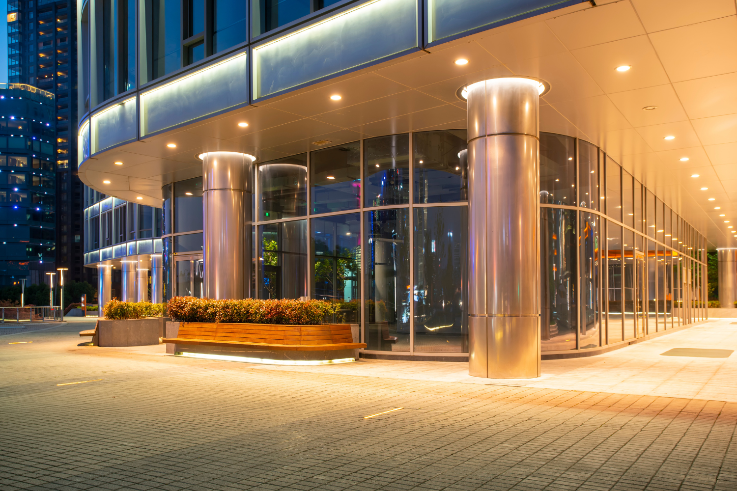 Illuminated entrance of a contemporary office building