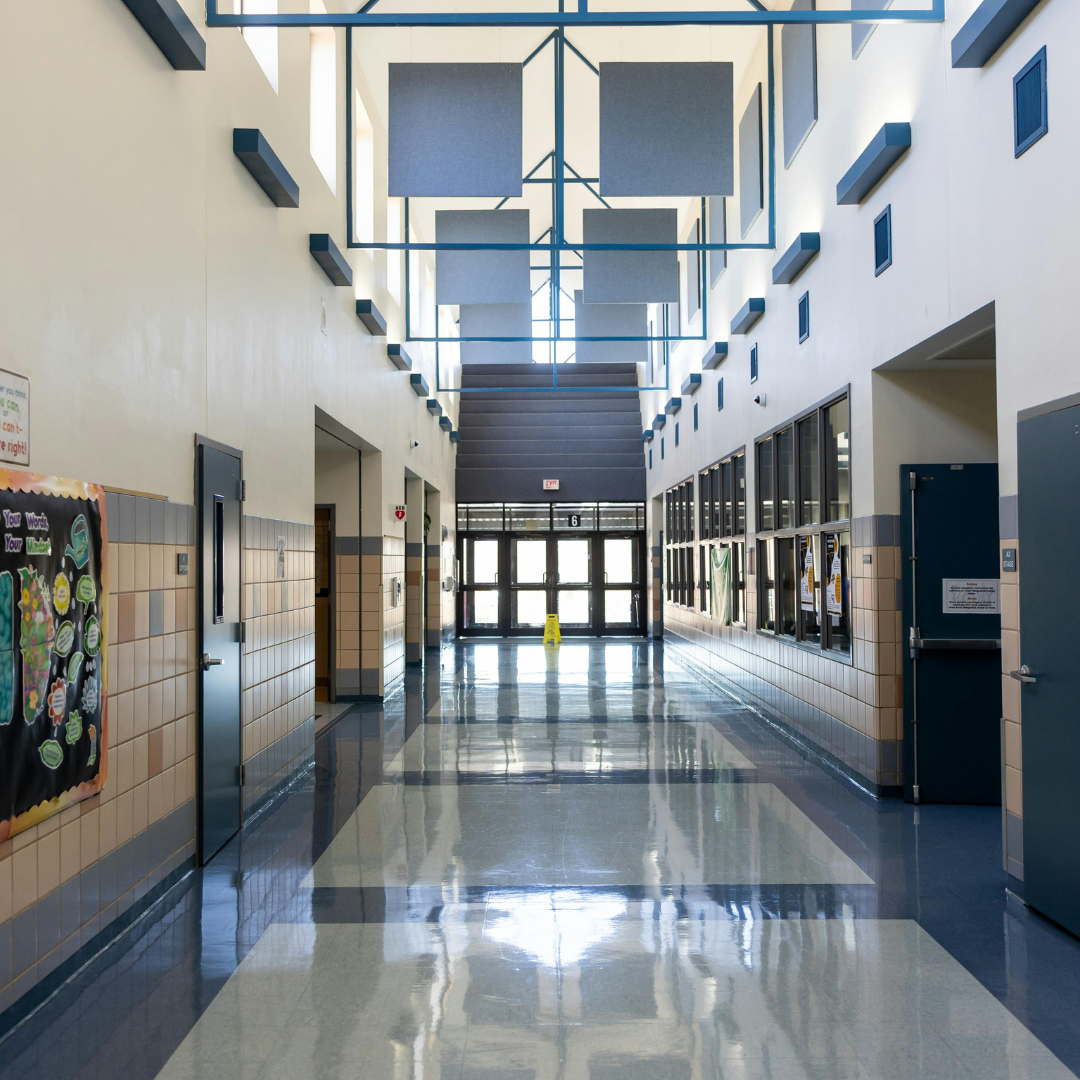 School corridor with lockers and overhead lighting